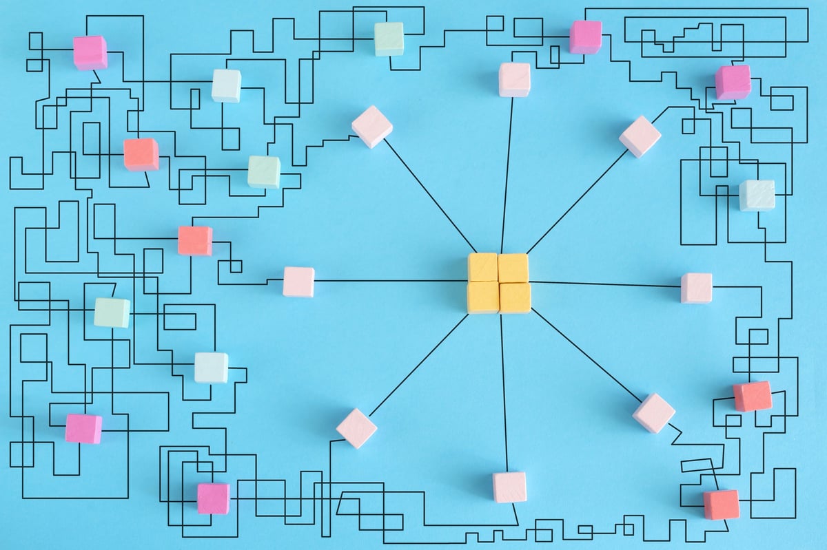 Abstract visualization of disconnected versus connected business systems showing the transformation from fragmented tactics to integrated client-acquisition infrastructure